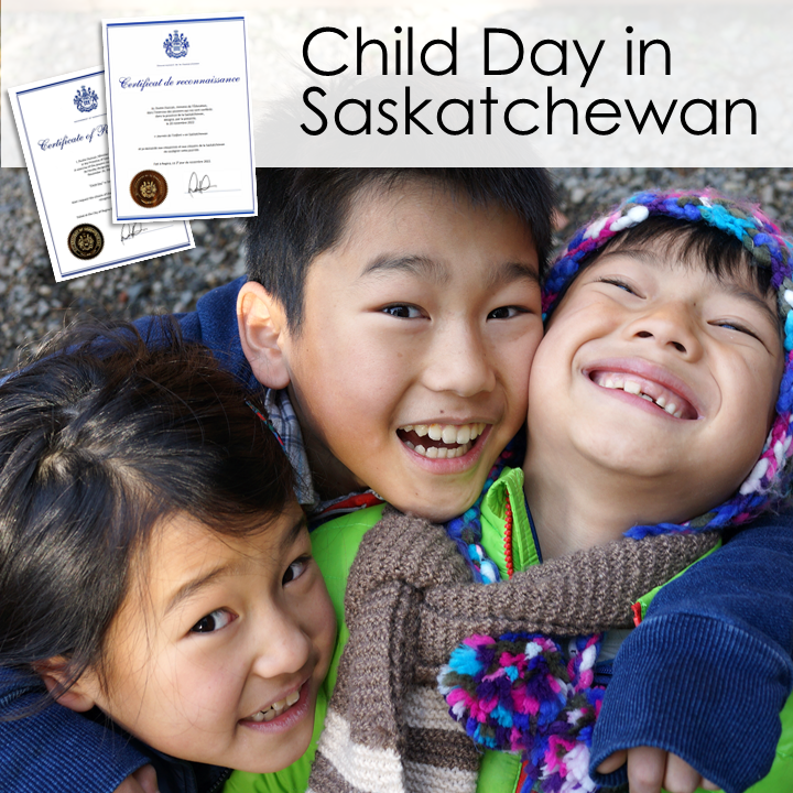 The image is of three young children, smiling and laughing together. They are dressed warmly and enjoying being outdoors. They have their arms around each other. There are small images of the Child Day proclamations in English and in French. The text reads "Child Day in Saskatchewan".